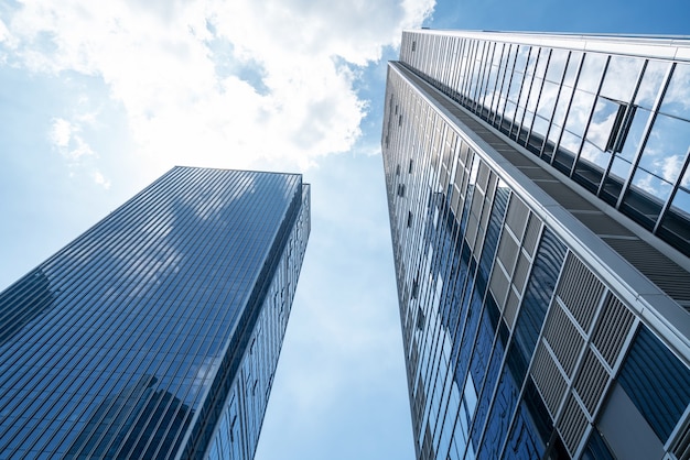 Photo looking up blue modern office building