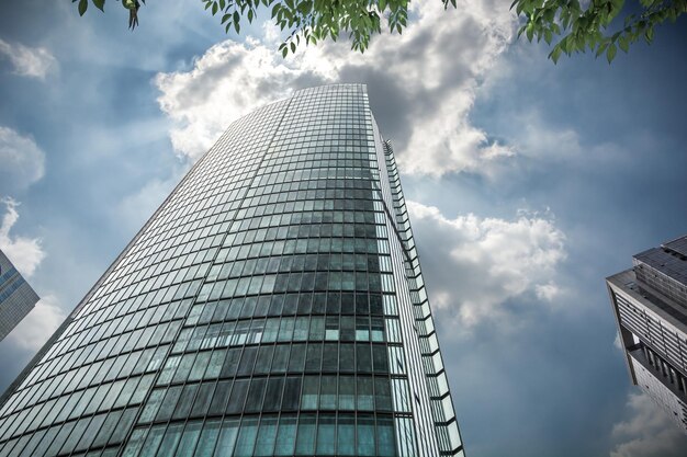 Photo looking up at modern business buildings