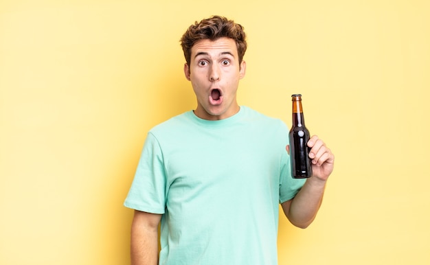 Looking very shocked or surprised, staring with open mouth saying wow. beer bottle concept