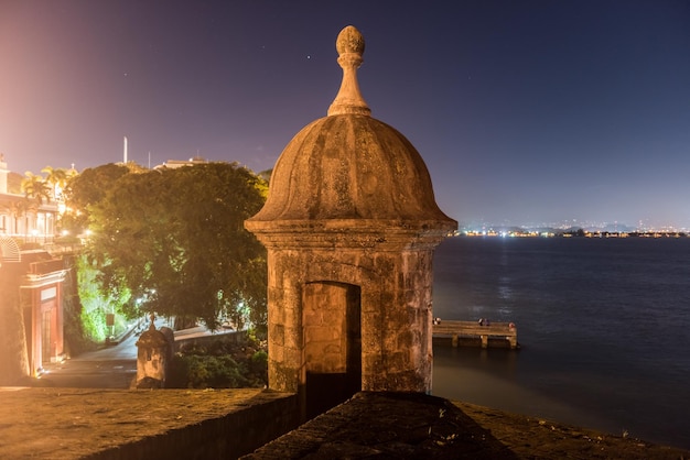 Lookout Tower along the walls of Old San Juan Puerto Rico from Plaza de la Rogativa with a view of the San Juan Gate
