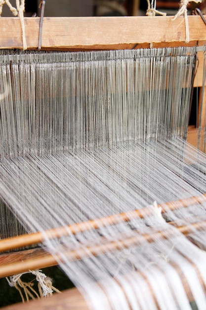 Loom with white thread background