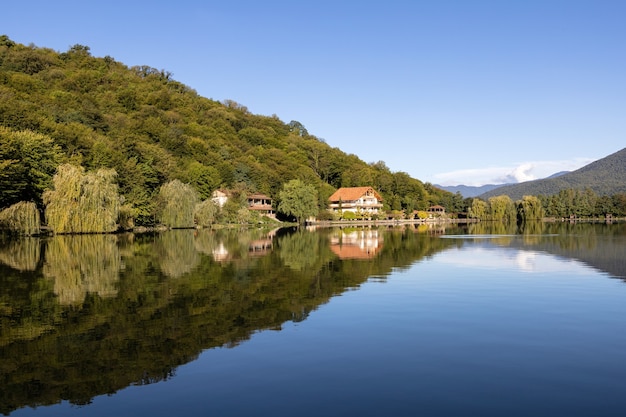 Lopota lake in early autumn with reflection of mountain in calm blue water, Kakheti region, Georgia