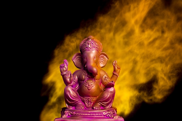 Lord ganesha sclupture over dark background. celebrate lord ganesha festival.