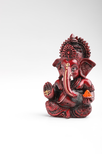 Lord ganesha sculpture on white background