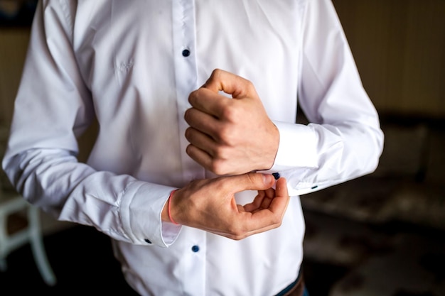 Lose up of a man in white shirt and cufflink Groom photosession Wedding pictures Businessman