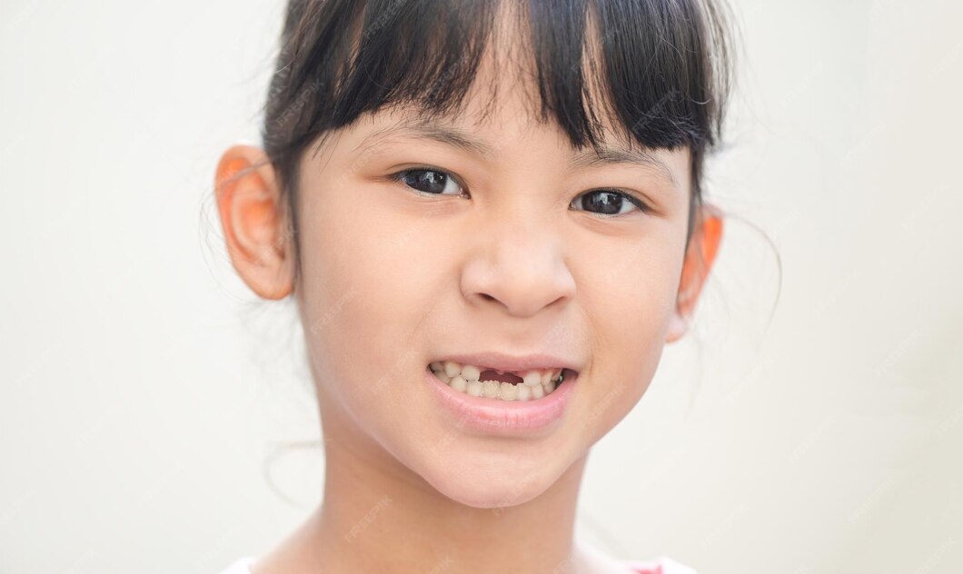 Premium Photo | Lost milk teeth lost baby tooth smile face of a child