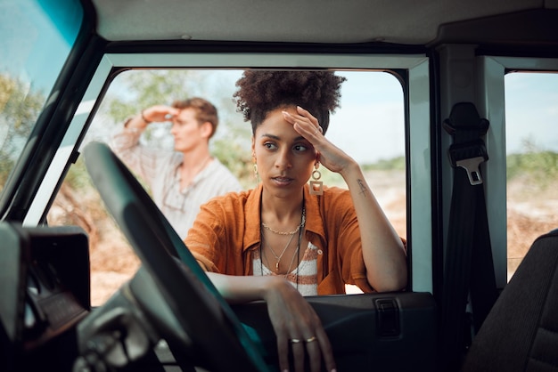 Lost stress and road trip couple waiting for emergency roadside assistance car mechanic service and transport insurance help in safari desert Sad woman anxiety driving crisis and accident problem