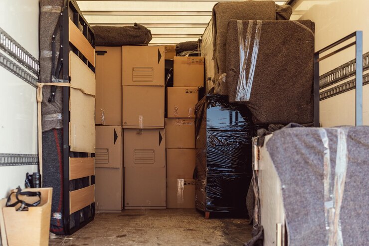 Photo a lot of boxes and packages from a move inside a truck
