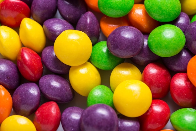 Lot of bright sweet candy, colored background