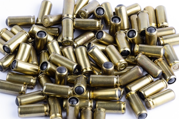 A lot of cartridges for a traumatic gun on a white background