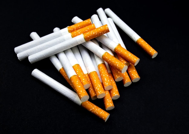 A lot of cigarettes on a black isolated background