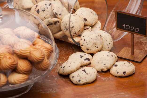 Lot of cookies in a vase of glass on the background crumbly biscuits