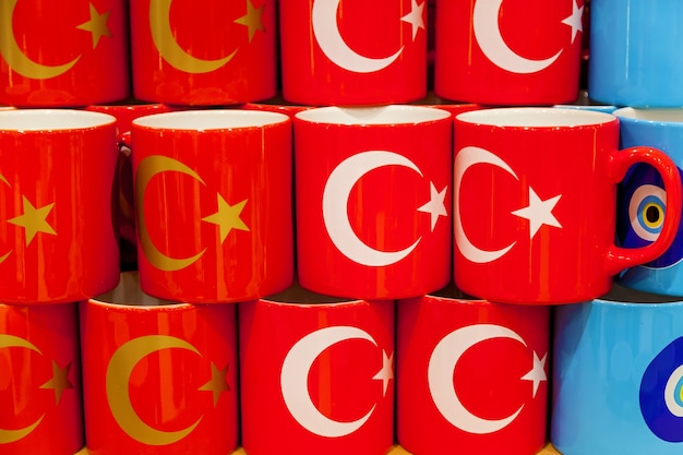 A lot of cups with a picture of a national Turkish flag on the market