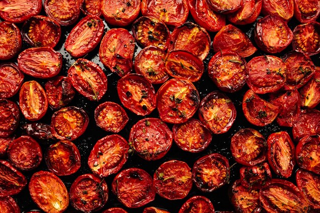 a lot of cut tomatoes for drying