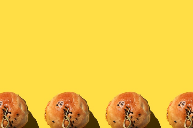 A lot of delicious yellow macaroons on a blue background