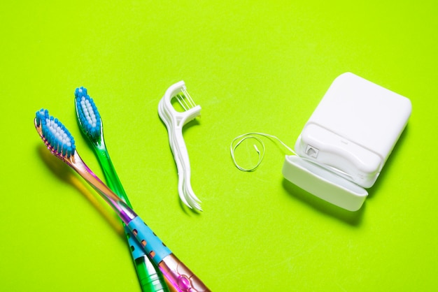 Lot of dental floss, toothbrush, toothpick