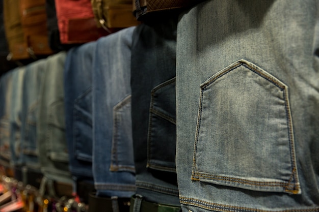 A lot of different blue jeans in the shop