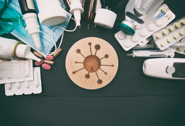 A lot of different drugs, pills and other medicine on the wooden white table