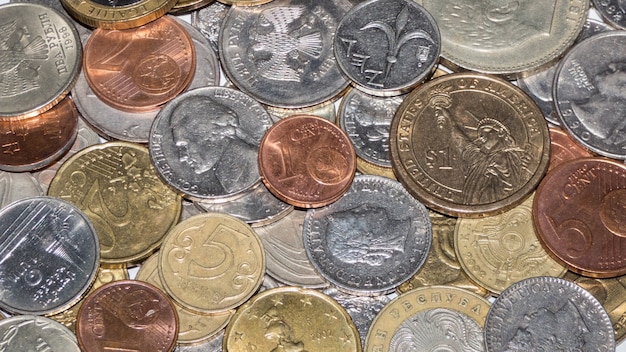 A lot of different metal coins, view from above. background of coins