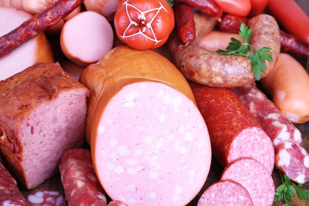 Lot of different sausages closeup background