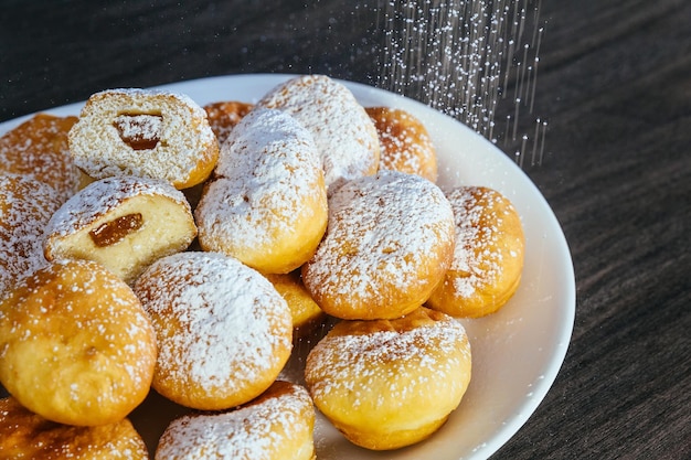 A lot of donuts on the counter in a supermarket donuts with jam