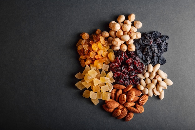 A lot of dried fruits on a black surface