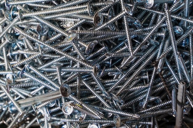 A lot of metal screws close up