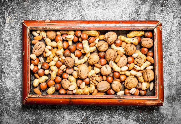 A lot of nuts in old tray.