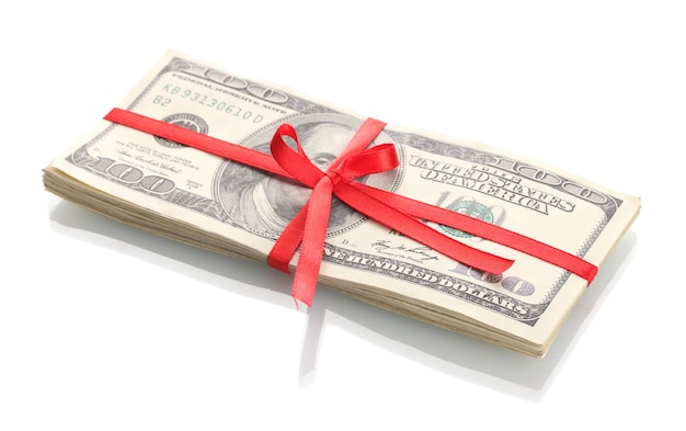 A lot of one hundred dollar bills tied red ribbon isolated on white