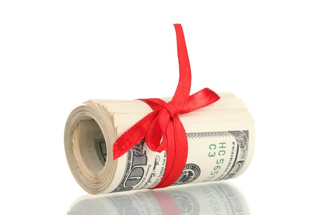 a lot of one hundred dollar bills tied red ribbon isolated on white