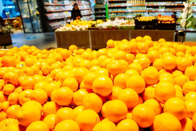 Lot of oranges in store. healthy food. grocery store