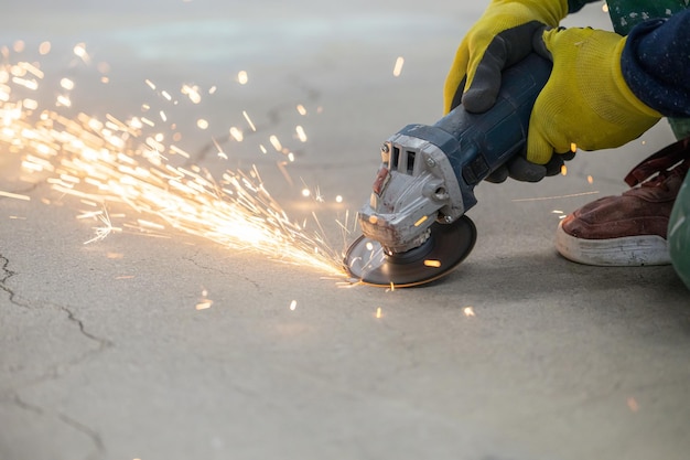 A lot of sparks from grinding with a grinder repair with a grinder metal cutting closeup