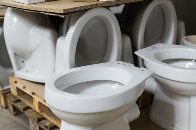 Lot of white toilets in hardware store plumbing department