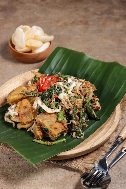 Lotek is an Indonesian traditional salad consist of vegetable with sweet and spicy peanuts sauce