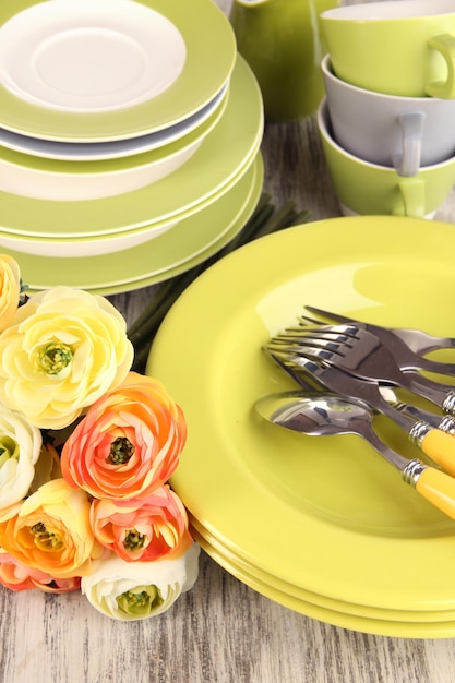 Lots beautiful dishes on wooden table closeup