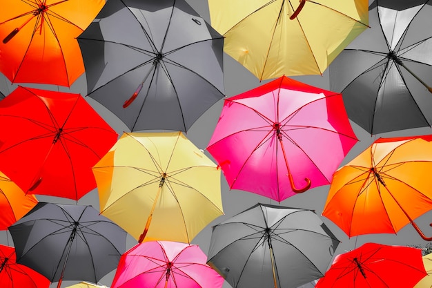 Lots of colorful umbrellas as background. City decoration