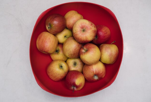 Lots of fresh red apples on the table