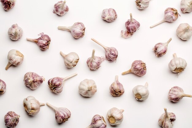 Lots of garlic top view on white background menu and food concept