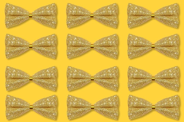 Lots of golden bows on a yellow background