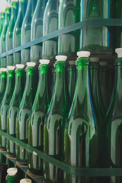 Lots of green bottles stand in a row