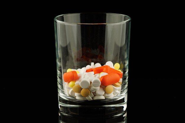 Lots of pills in a glass