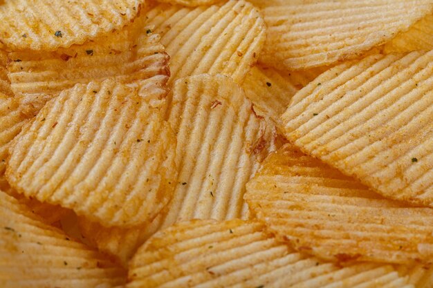 Lots of potato chips texture close up