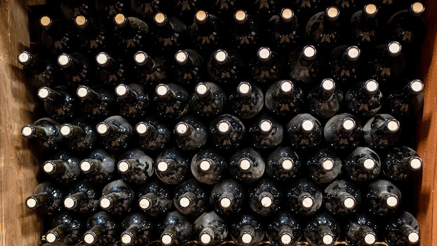 Lots of red wine bottles at a winery