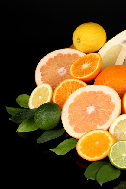 Lots ripe citrus isolated on black