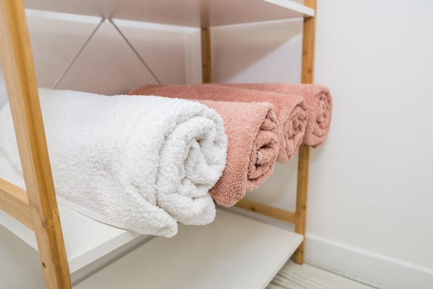 Lots of rolled towels on a shelf in a beauty salon massage parlor and barbershop Care and hygiene item