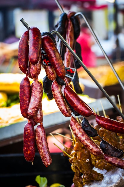 lots of sausages and chorizos in a medieval fair