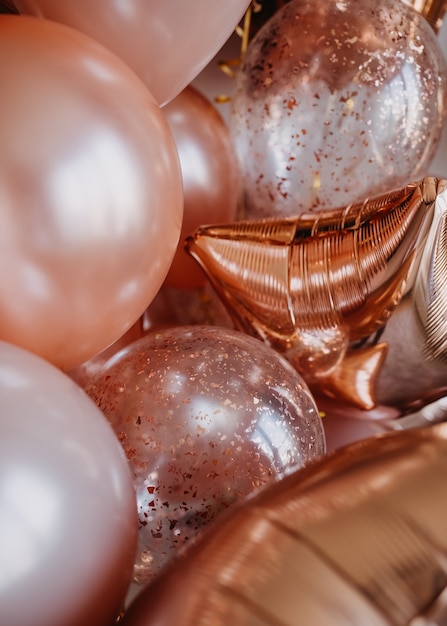 Lots of shiny rose gold pink balloons background