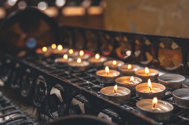 Lots of small candles in a catholic church