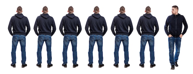 Lots of standing men in jeans and a blue hoodie Back view One handsome man steps out of their lines front view Isolated on white background panorama format