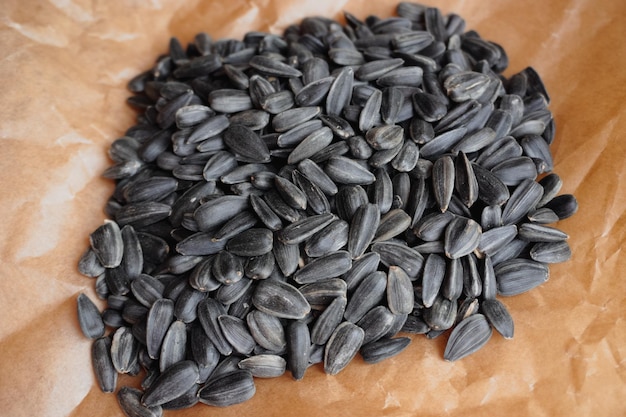 Lots of sunflower seeds lying on paper closeup